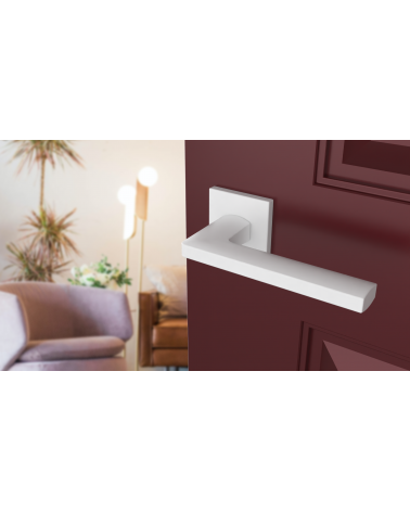 PYROLA zamak door handle design ironmongery angled top view mounted on an ajar door