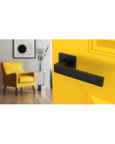 SULLA zamak door handle design handle colour 2 angled top view mounted on a door