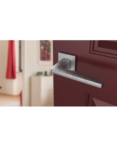 ERBA zamak door handle design handle colour 2 angled top view mounted on a door