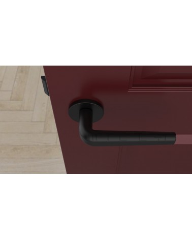 INULLA round plate door handle designer handle top view mounted on a door