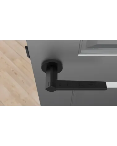 NINFEA door handle on round plate designer hardware top view fitted on a door