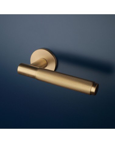 MOLINIA matt gold door handle designer handle fitted on a door