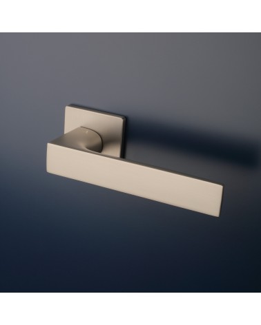 ALISSO door handle designer handle colour 1 mounted on a door