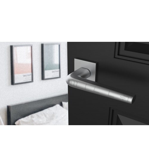 Polished chrome door handle on square plate FUNKIA - designer handle