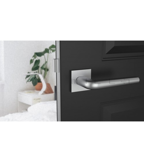 Polished chrome door handle on square plate FUNKIA - designer handle