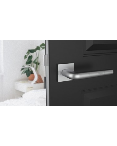 Polished chrome door handle on square plate FUNKIA - designer handle