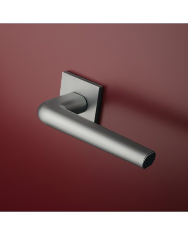 Polished chrome door handle on square plate FUNKIA - designer handle
