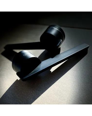 Futuristic door handle JUMELLE designer handle on black background