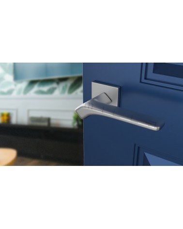 BERGERIA satin chrome door handle designer hardware angled view mounted on a door