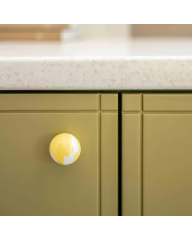 Yellow beech wood furniture knob design handle zoomed view mounted on a cabinet