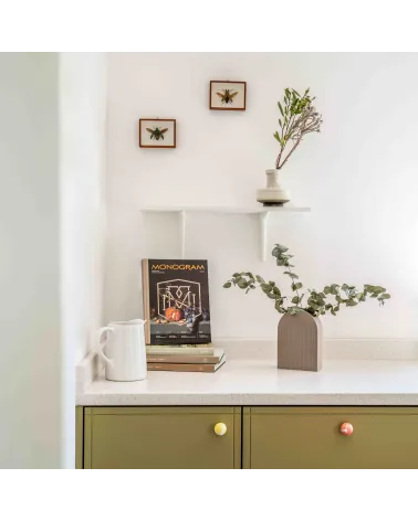 Yellow beech wood furniture knob design handle front view installed on a chest of drawers