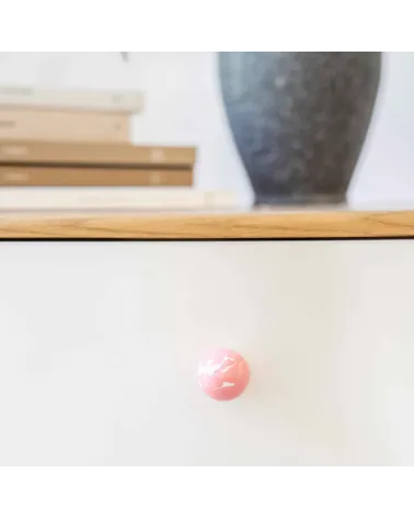 Pink beech wood furniture knob design handle front view fixed on a cabinet
