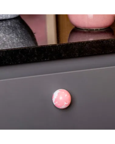 Pink beech wood furniture knob design handle zoomed view mounted on a cabinet