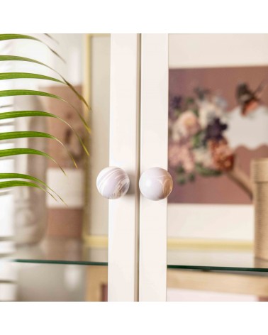 Lavender beech wood furniture knob design handle fixed on a glass door with a blurred background