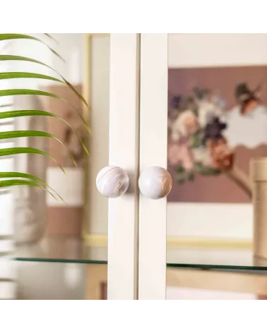 Lavender beech wood furniture knob design handle fixed on a glass door with a blurred background