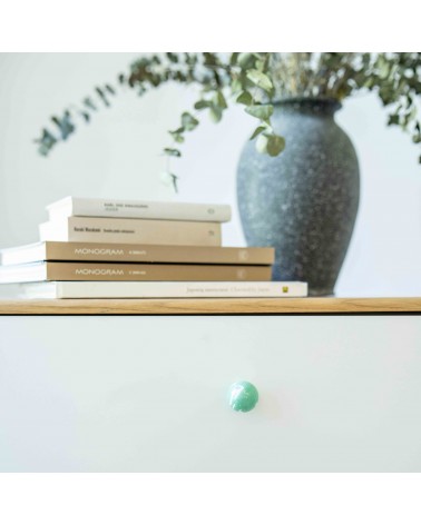 Rich green beech wood furniture knob design handle fixed on a drawer