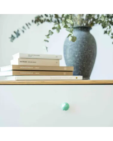 Rich green beech wood furniture knob design handle fixed on a drawer
