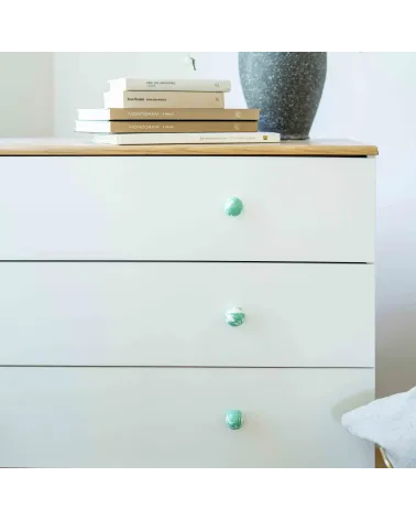 Rich green beech wood furniture knob design handle installed on a white chest of drawers