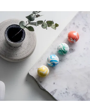 Rich green beech wood furniture knob design handle placed on a marble surface