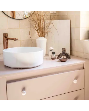 Rose taupe beech wood furniture knob design handle installed on a bathroom cabinet