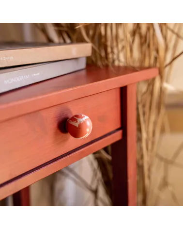 Cherry red beech wood furniture knob design handle fixed on a wooden drawer