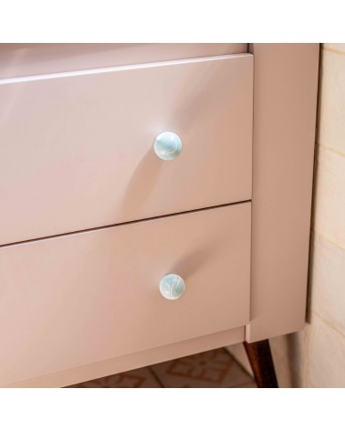 Grey blue beech wood furniture knob design handle fixed on a pink furniture front