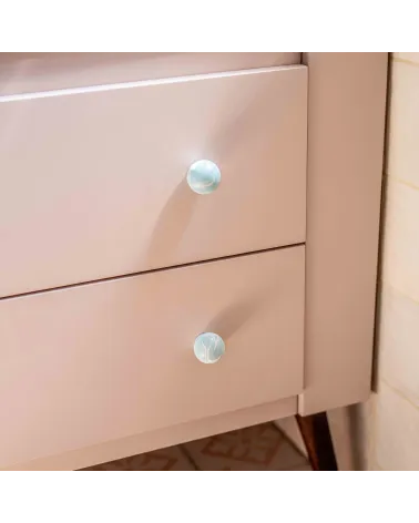 Grey blue beech wood furniture knob design handle fixed on a pink furniture front