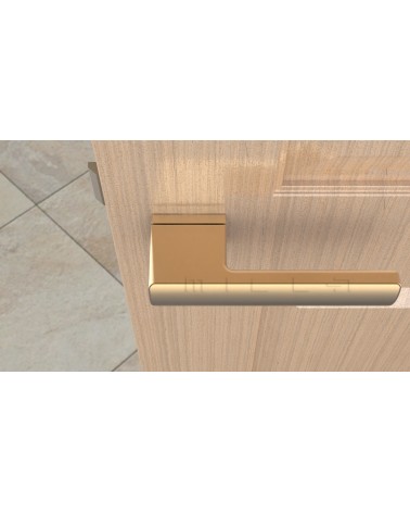 Matt gold BRISA door handle design handle top view mounted on a door