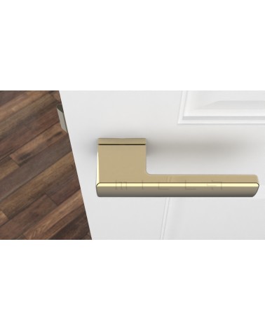 Polished gold BRISA door handle designer handle top view fitted on a door
