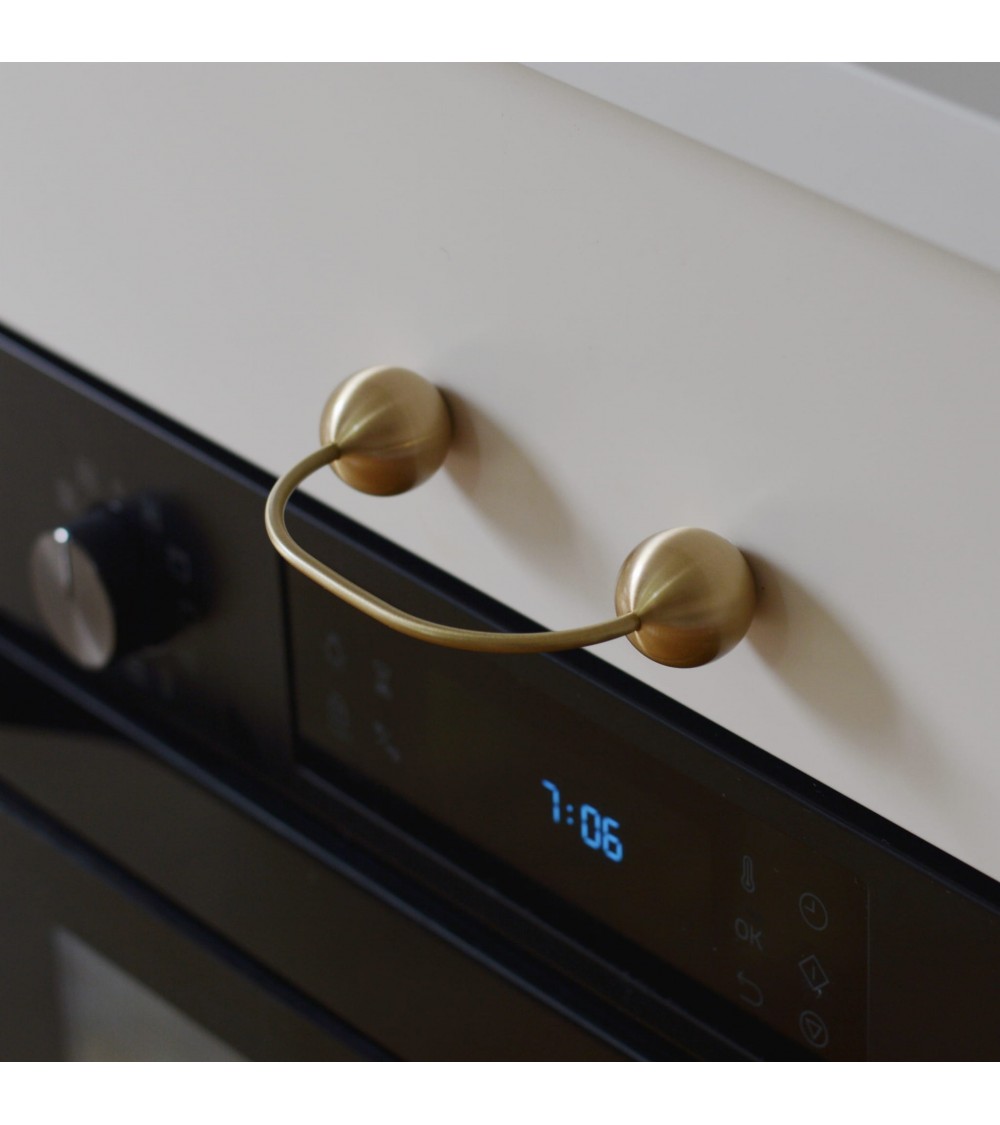 Brass furniture handle 10 designer handle top angled view fitted on a drawer