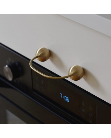 Brass furniture handle 10 designer handle top angled view fitted on a drawer