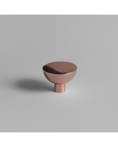 LUNA M copper furniture knob designer handle front view placed on a grey surface