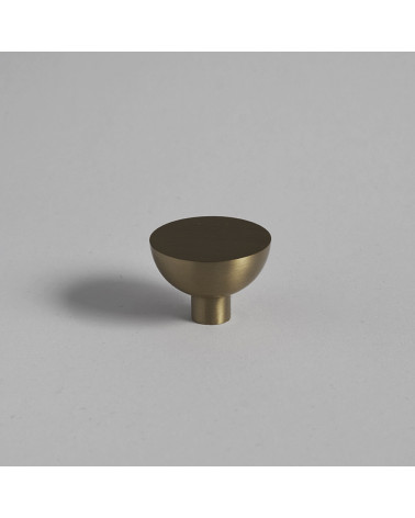 LUNA M matt gold furniture knob designer handle placed on a flat surface with a plain background