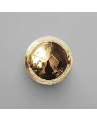 Polished gold ODETE furniture knob, designer handle placed on grey background
