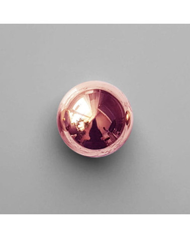 Copper ODETE M furniture knob, designer handle, top view on a light surface