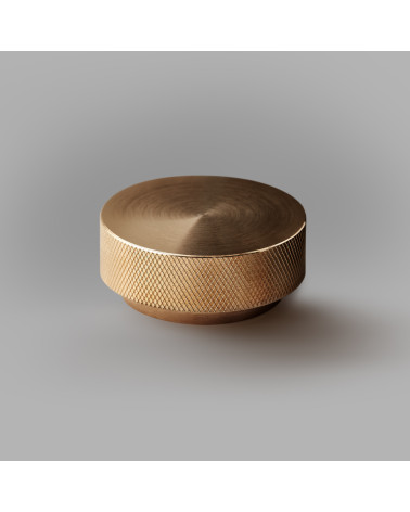Matt gold TOVE furniture knob, designer handle, large model on a grey background