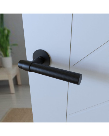 Black GHOST door handle design handle mounted on a half-open door