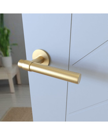 GHOST textured door handle designer handle mounted on a door angled view