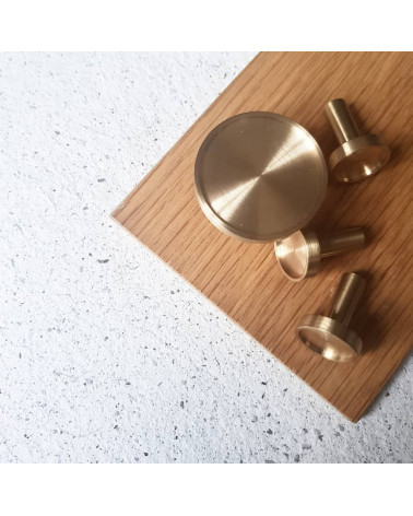 INA brass furniture knob design handle top view placed on wooden board