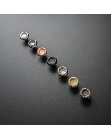 CAMPANA furniture knob design handles aligned on a black surface