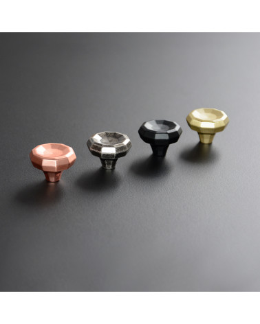 CAMPANA furniture knob design handles arranged in a line on a light surface