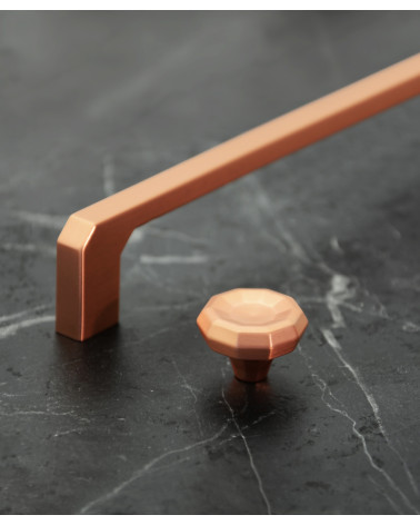 CAMPANA copper designer furniture knob handle presented on a marble surface
