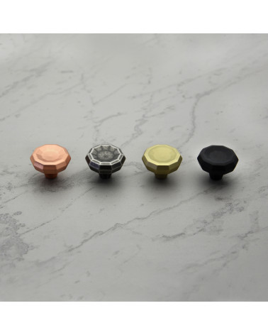 CAMPANA designer furniture knob handle aligned on a light marble surface
