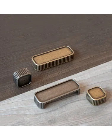 WEGA designer furniture knob handle placed on a wooden plate