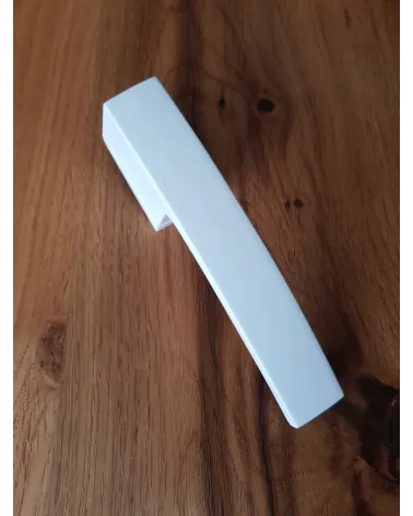 Futuristic Arc door handle designer handle top angled view placed on a plate