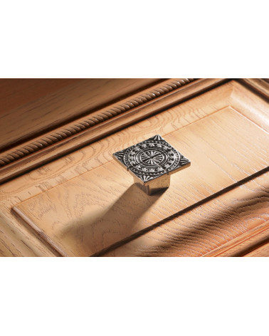 Furniture knob SPARTA design handle fitted on a wooden unit