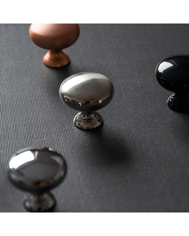 TORONTO furniture knob designer handle placed on a black surface