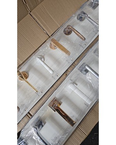 Close-up photo of the large millapoignees display stand with 16 door handles
