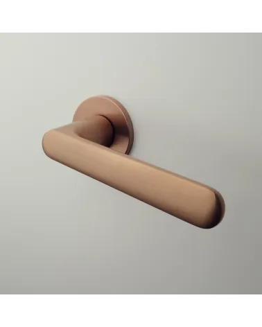 ARIA Copper Door Handle designer handle mounted on a door