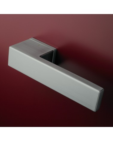 Satin chrome door handle CARLINA designer handle fitted on a door